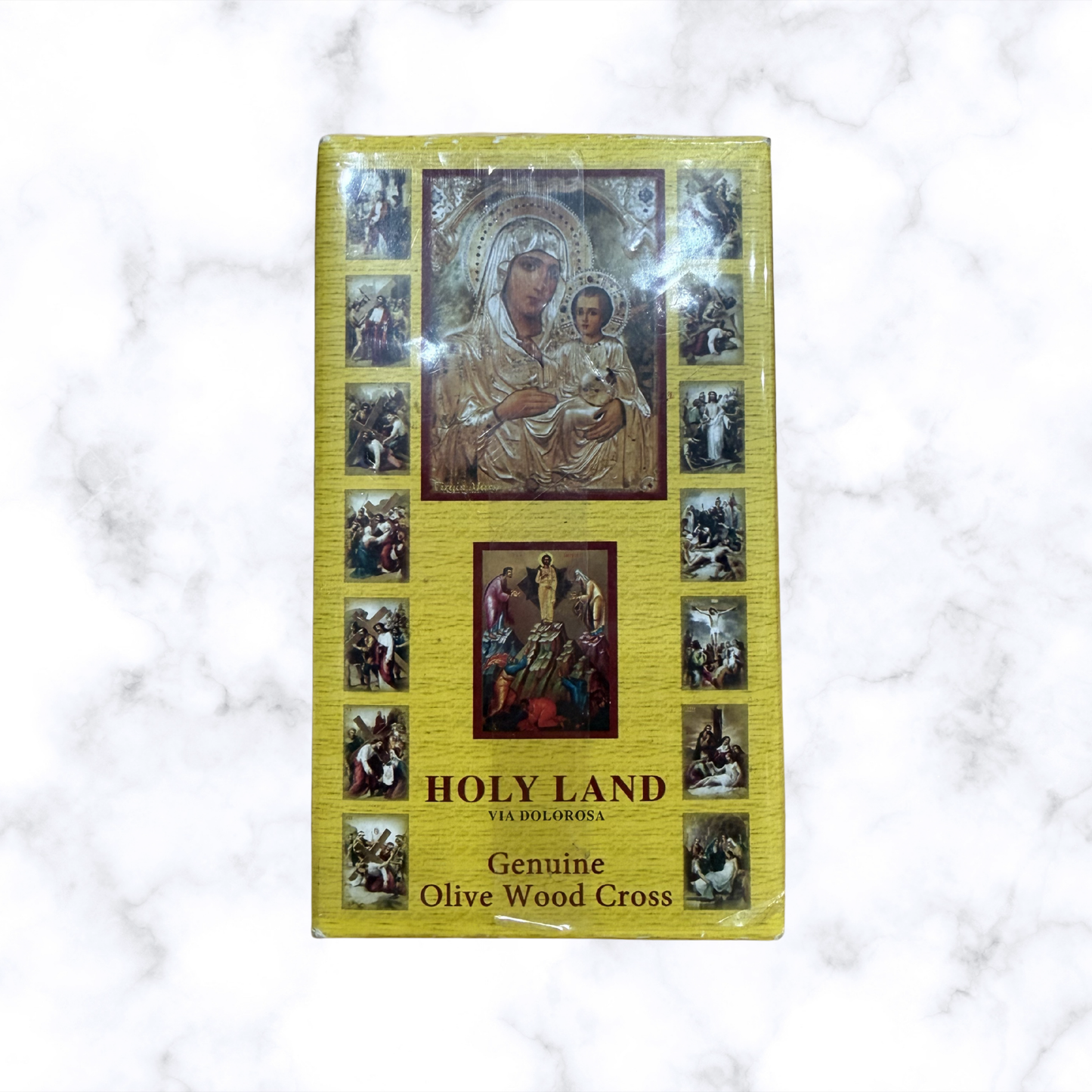 Front of Holy Land blessing gift set featuring a genuine olive wood cross and traditional Christian artwork on the gift box.