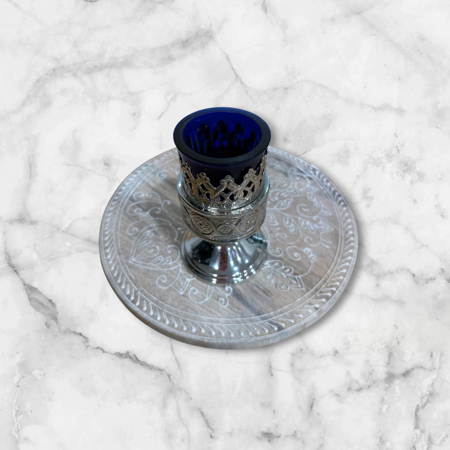 Orthodox blue glass votive lamp with ornate silver-tone holder for a home prayer corner
