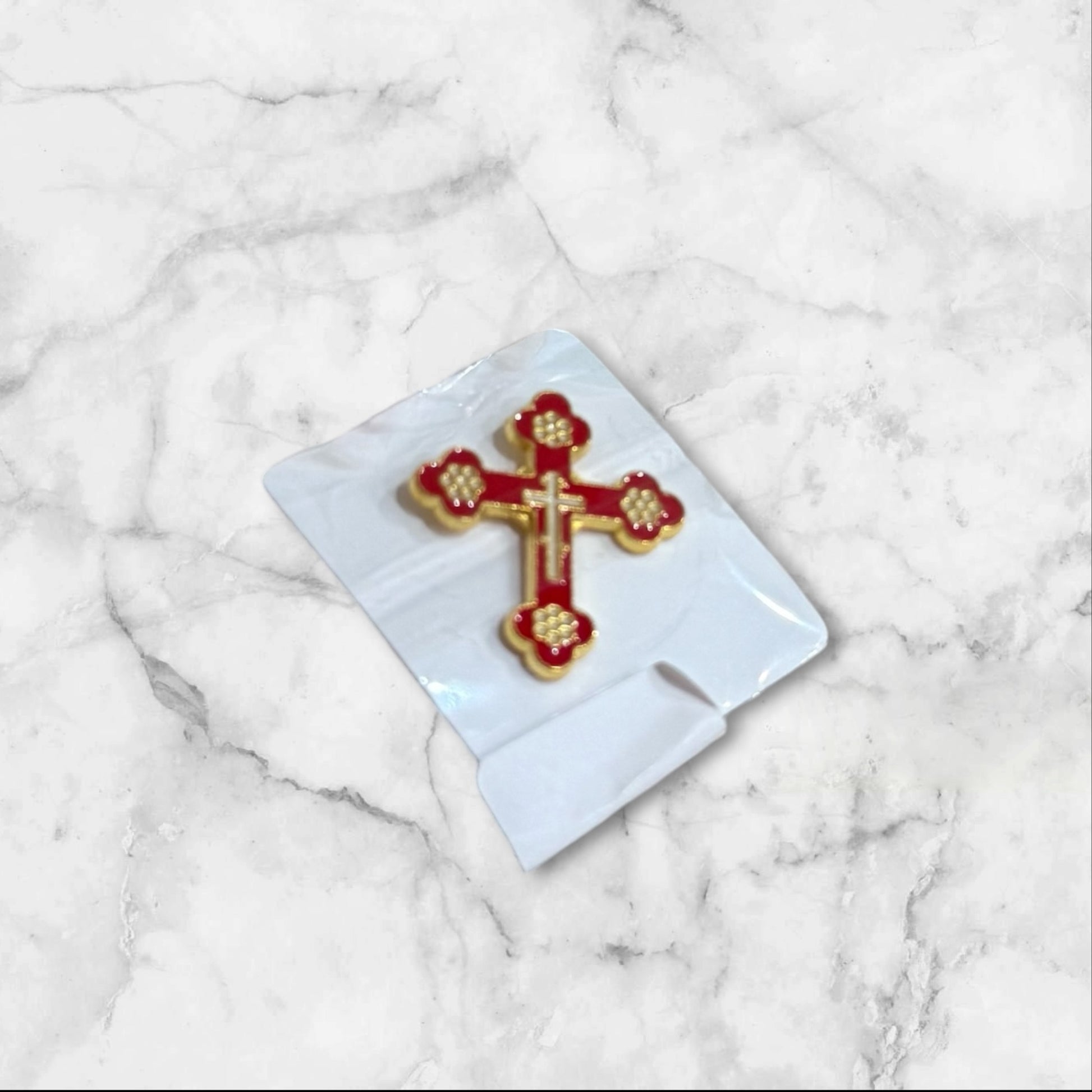 Red and gold enamel Christian cross lapel pin with secure metal backing, measuring 1 inch tall.