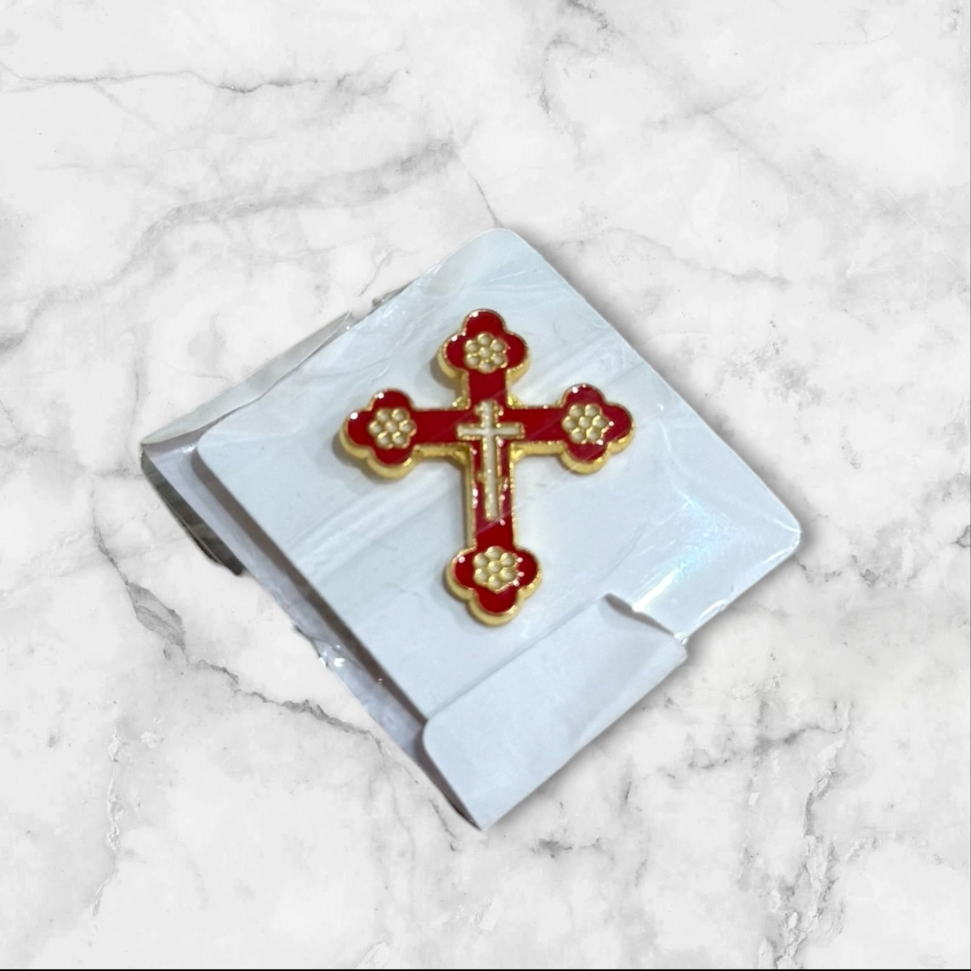 Red and gold enamel Christian cross lapel pin with secure metal backing, measuring 1 inch tall.