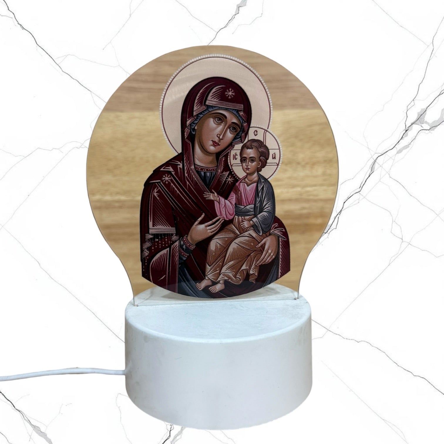 Illuminated acrylic LED night light featuring the Mother of God of Kazan icon on a white USB-powered base. Ideal for an icon corner, bedside table, nursery, or prayer space.