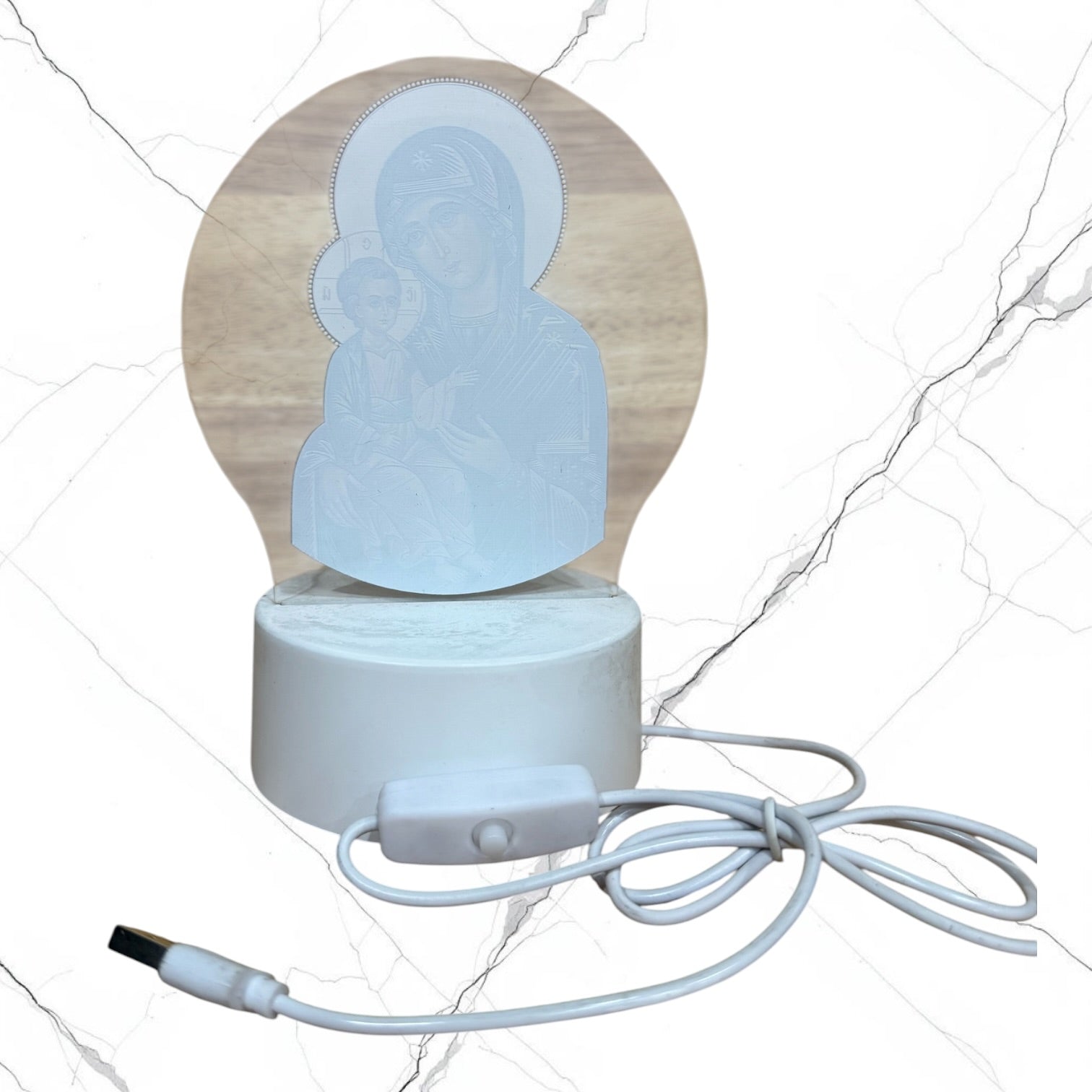 Illuminated acrylic LED night light featuring the Mother of God of Kazan icon on a white USB-powered base. Ideal for an icon corner, bedside table, nursery, or prayer space.