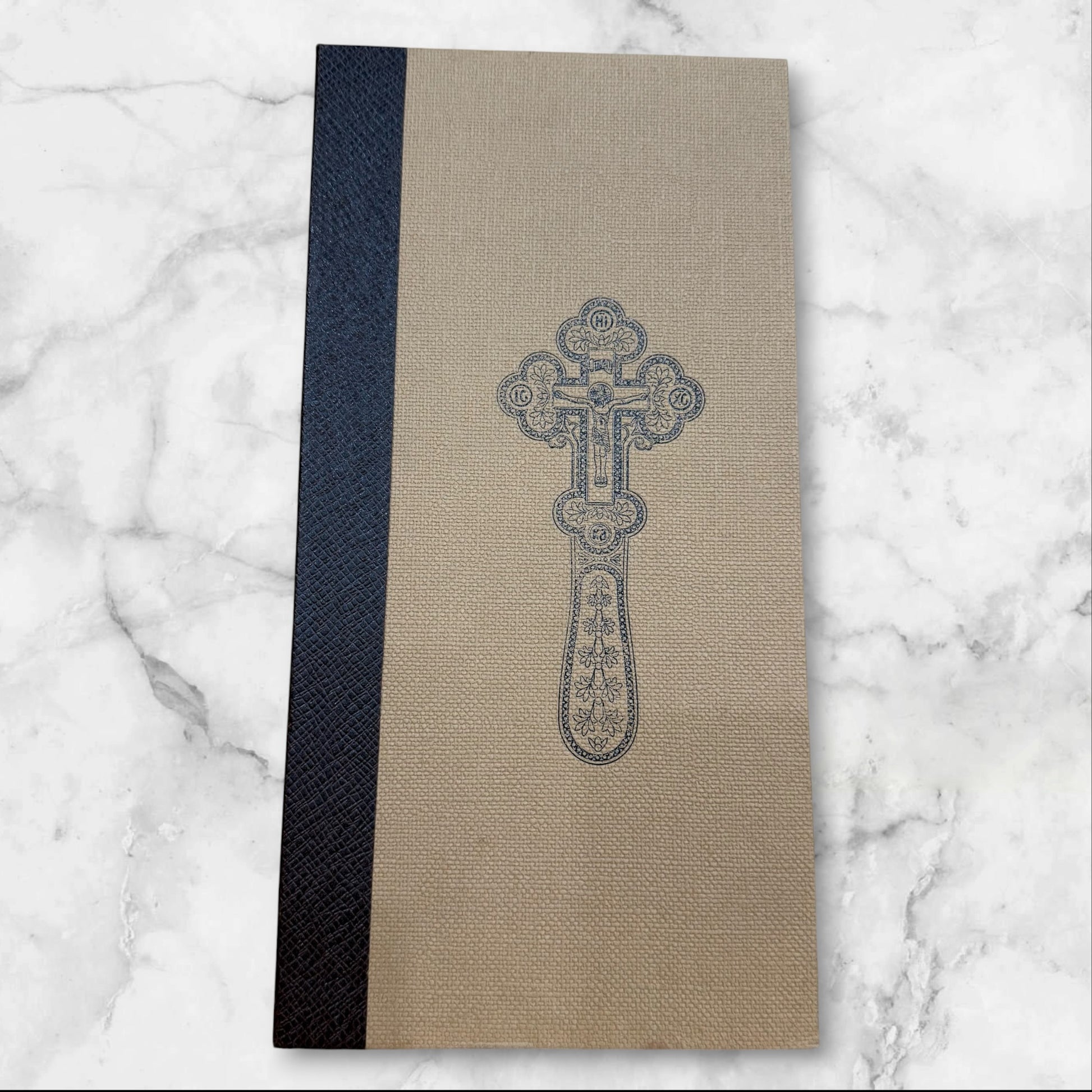 Green enamel blessing cross with decorative metal crucifix in a premium gift box, measuring 7.875 inches tall.