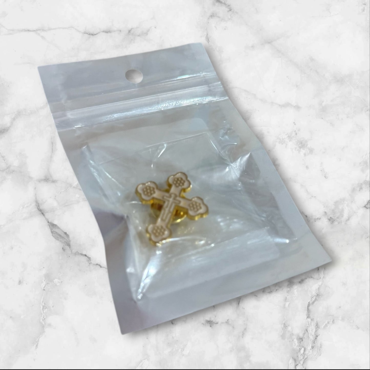 White and gold Orthodox cross lapel pin with enamel finish and secure metal backing, measuring 1 inch tall.