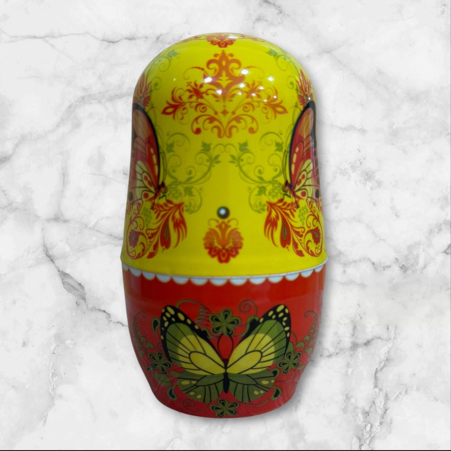 Yellow Russian Matryoshka nesting doll manicure set with a six-piece stainless steel nail care kit inside a decorative travel case.