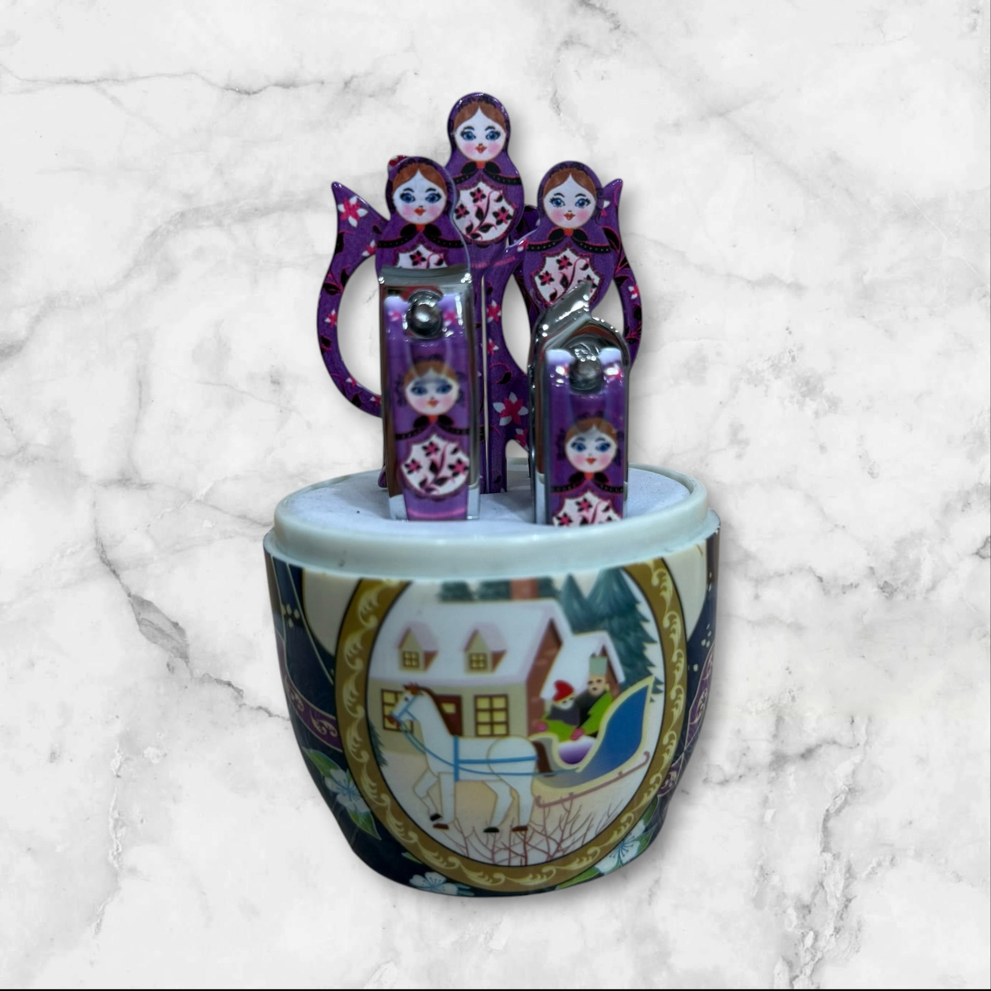 Russian Matryoshka nesting doll manicure set with a -piece stainless steel nail care kit inside a decorative travel case.