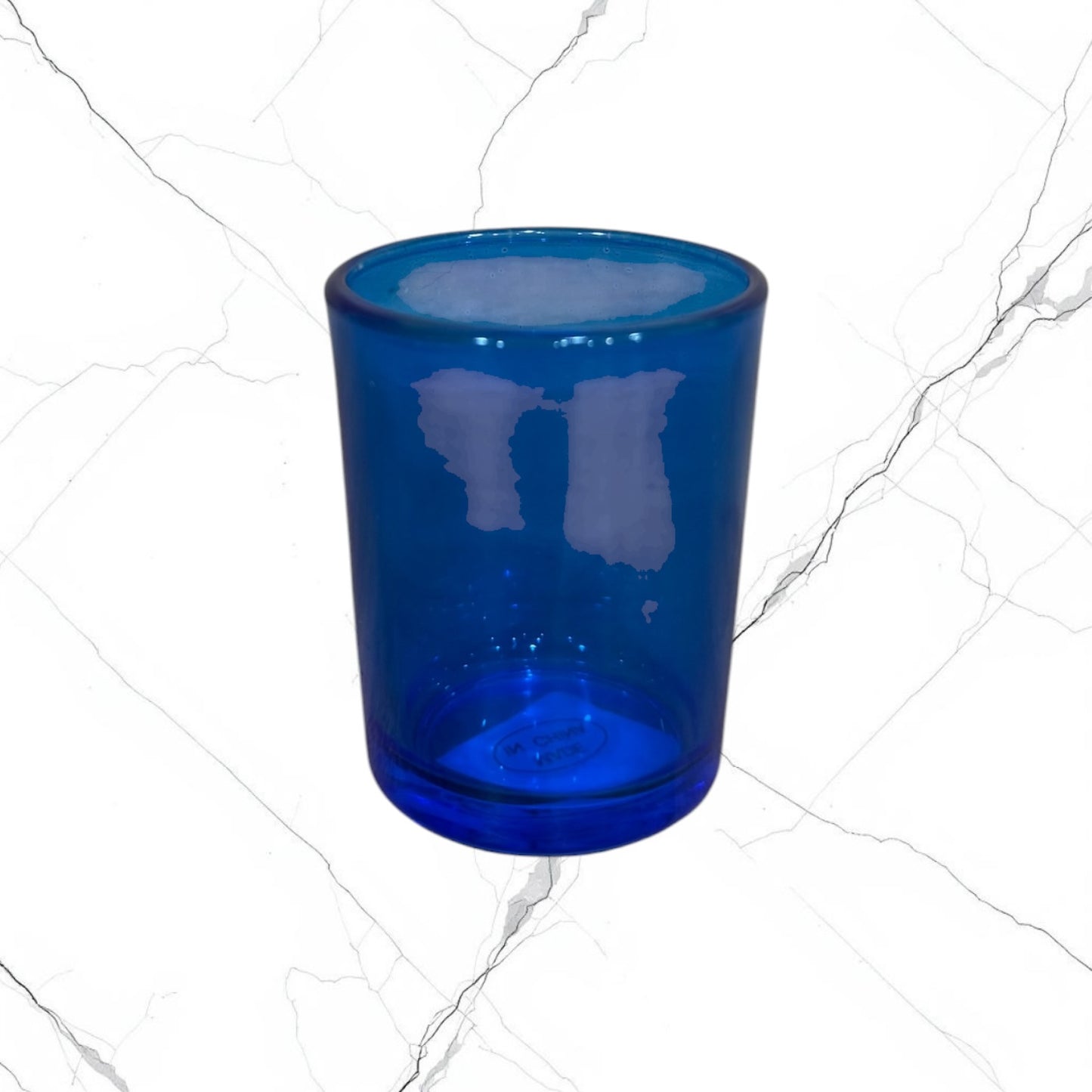 Blue glass votive candle holder for a home prayer corner or icon corner.
