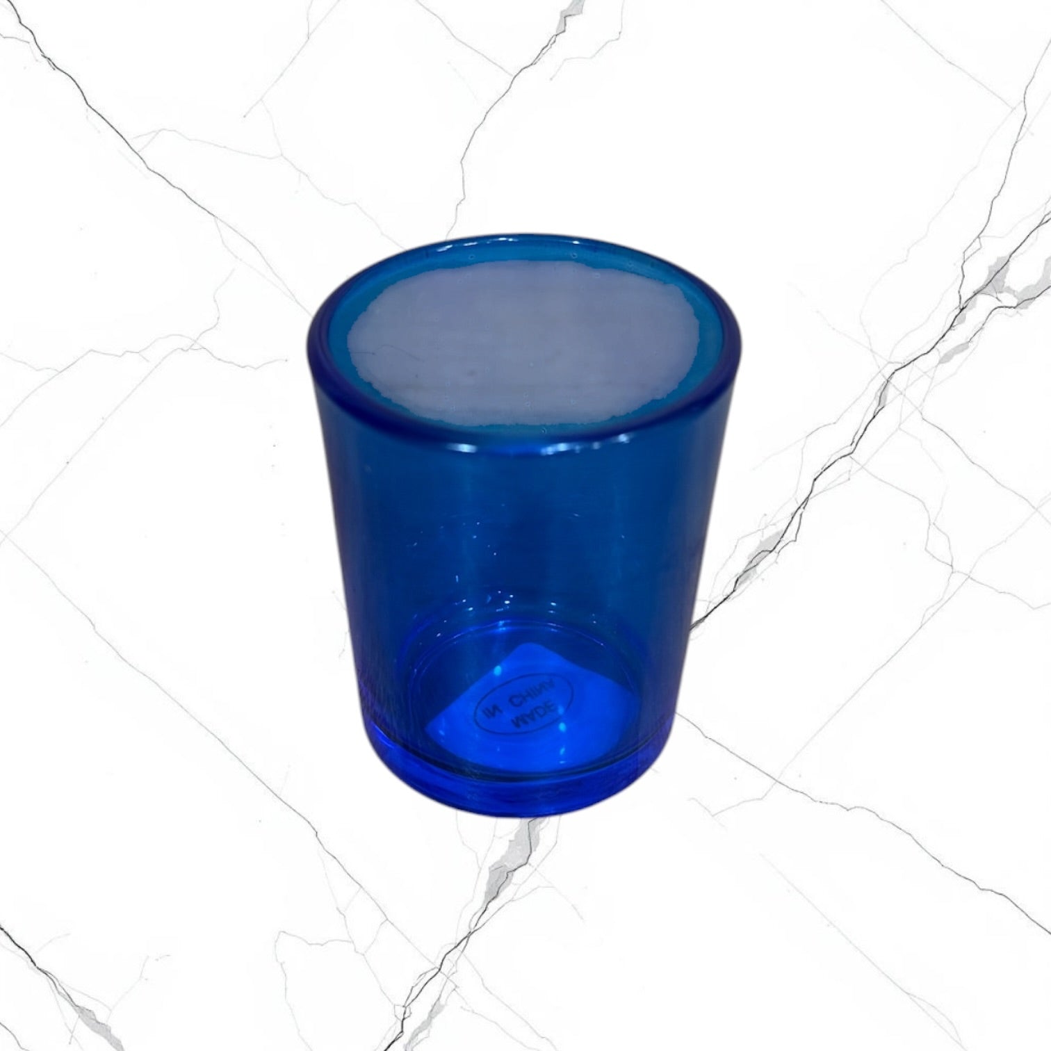 Blue glass votive candle holder for a home prayer corner or icon corner.