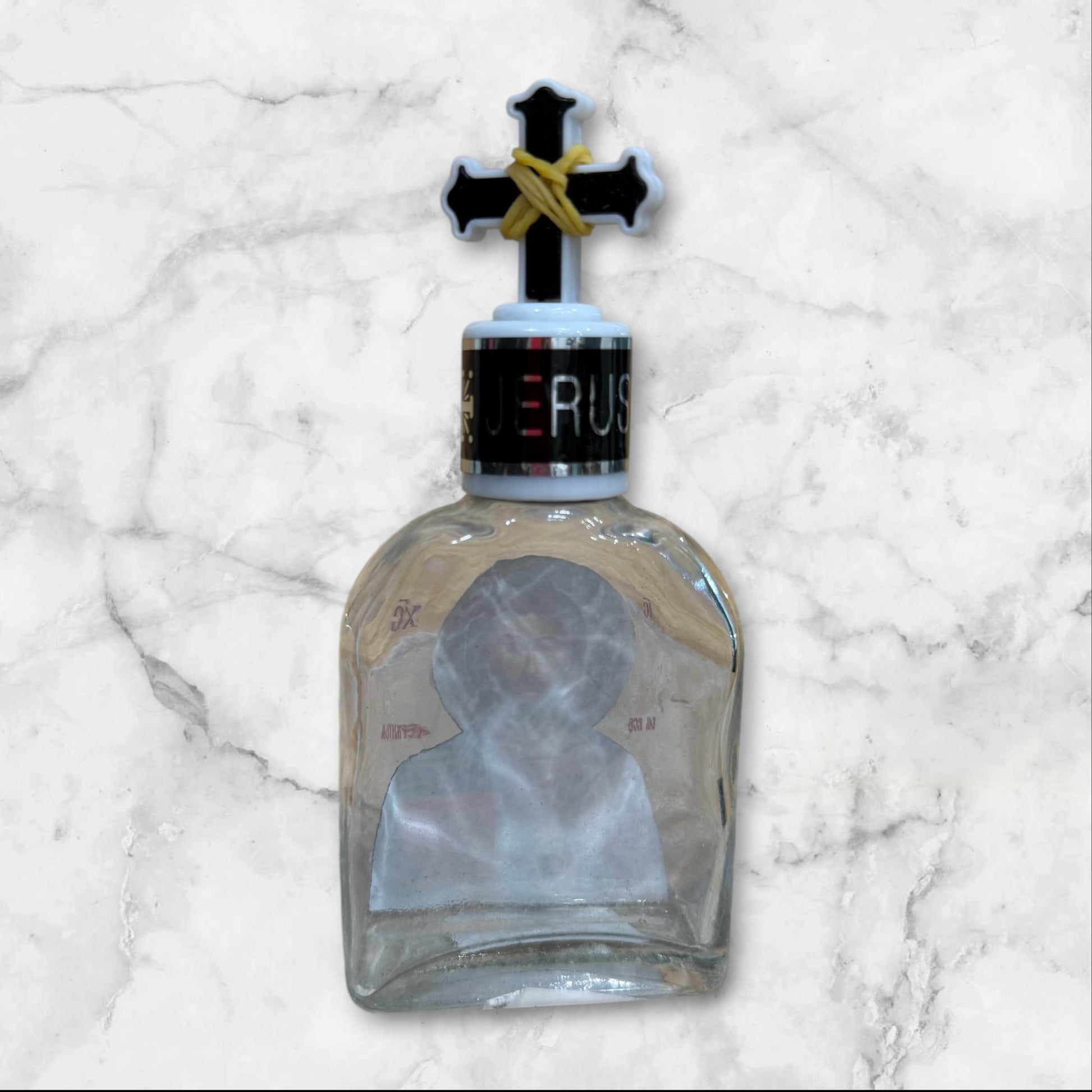 Orthodox holy water bottle featuring the icon of Christ the Teacher with decorative cross stopper back side