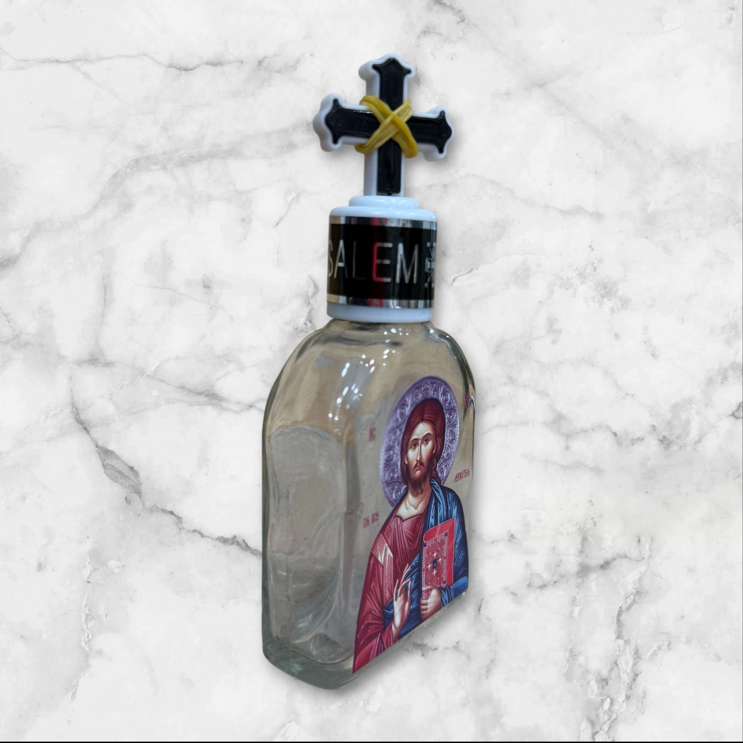 Orthodox holy water bottle featuring the icon of Christ the Teacher with decorative cross stopper side image