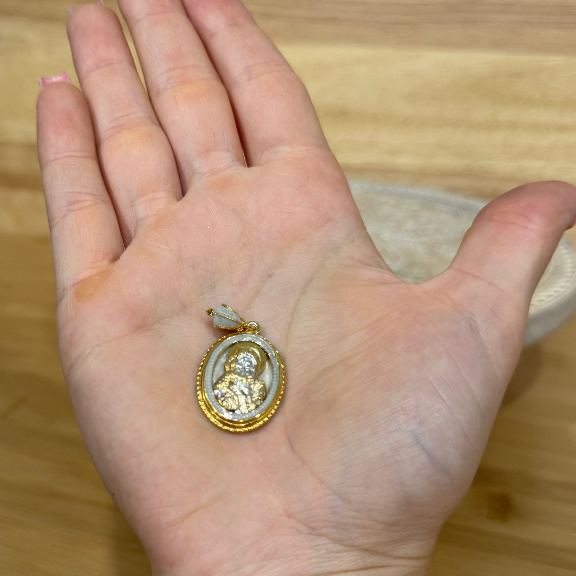 Gold-tone and white enamel Mother of God Hospitality of Abraham Orthodox icon pendant.