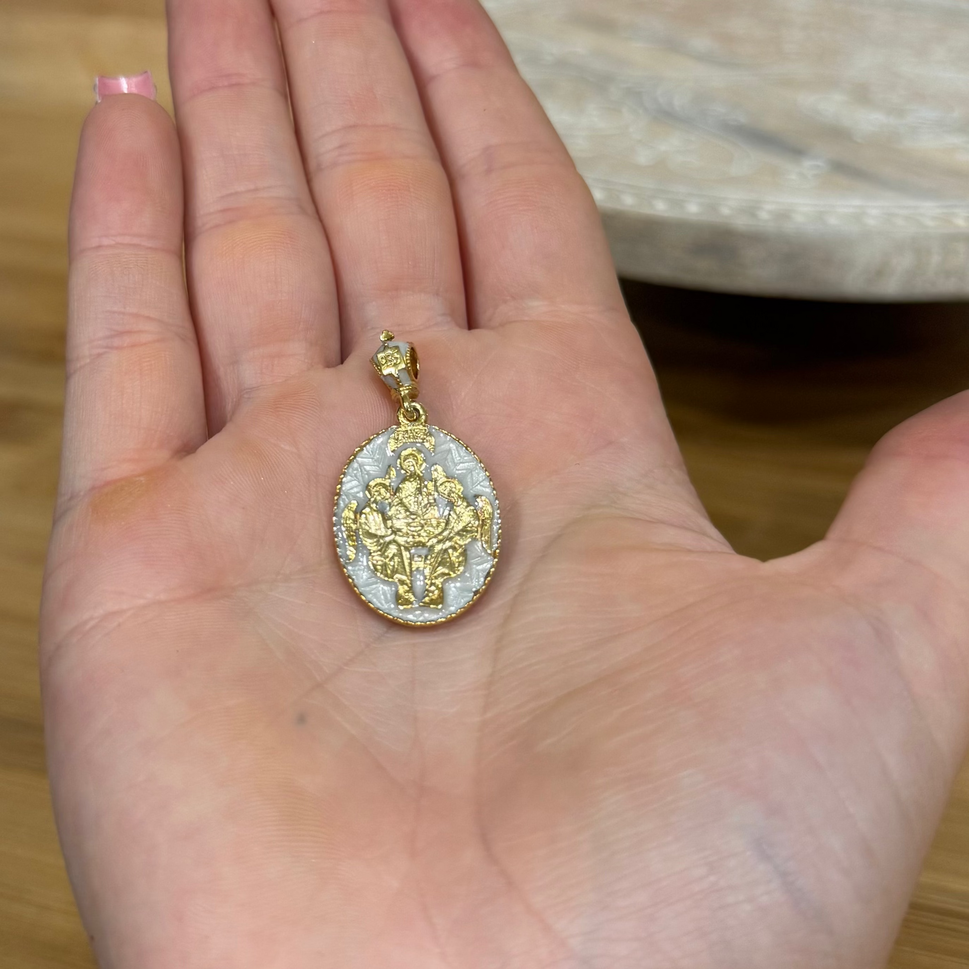 Gold-tone and white enamel Mother of God Hospitality of Abraham Orthodox icon pendant.