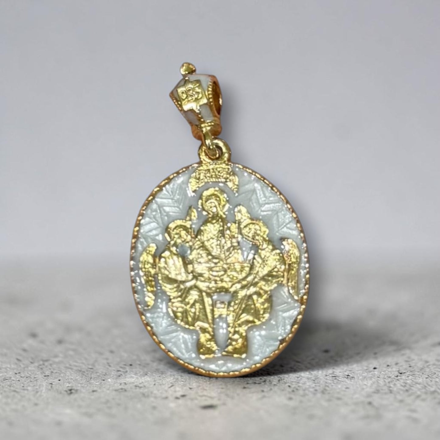 Gold-tone and white enamel Mother of God Hospitality of Abraham Orthodox icon pendant.