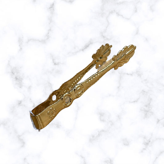 Ornate Orthodox brass charcoal tongs for handling incense charcoal during home prayer and church worship.