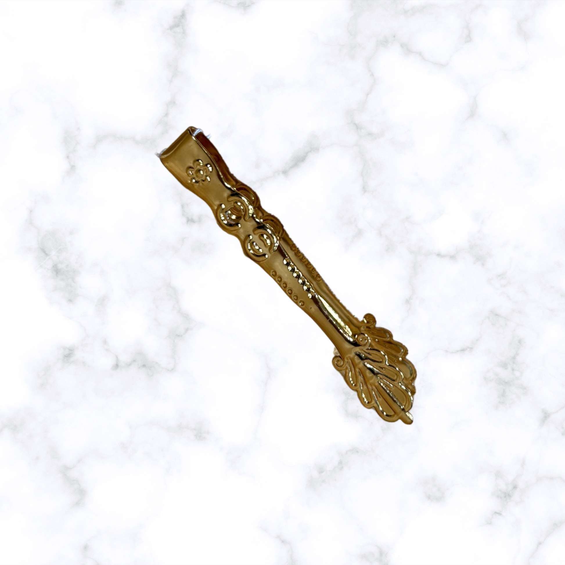 Ornate Orthodox brass charcoal tongs for handling incense charcoal during home prayer and church worship.