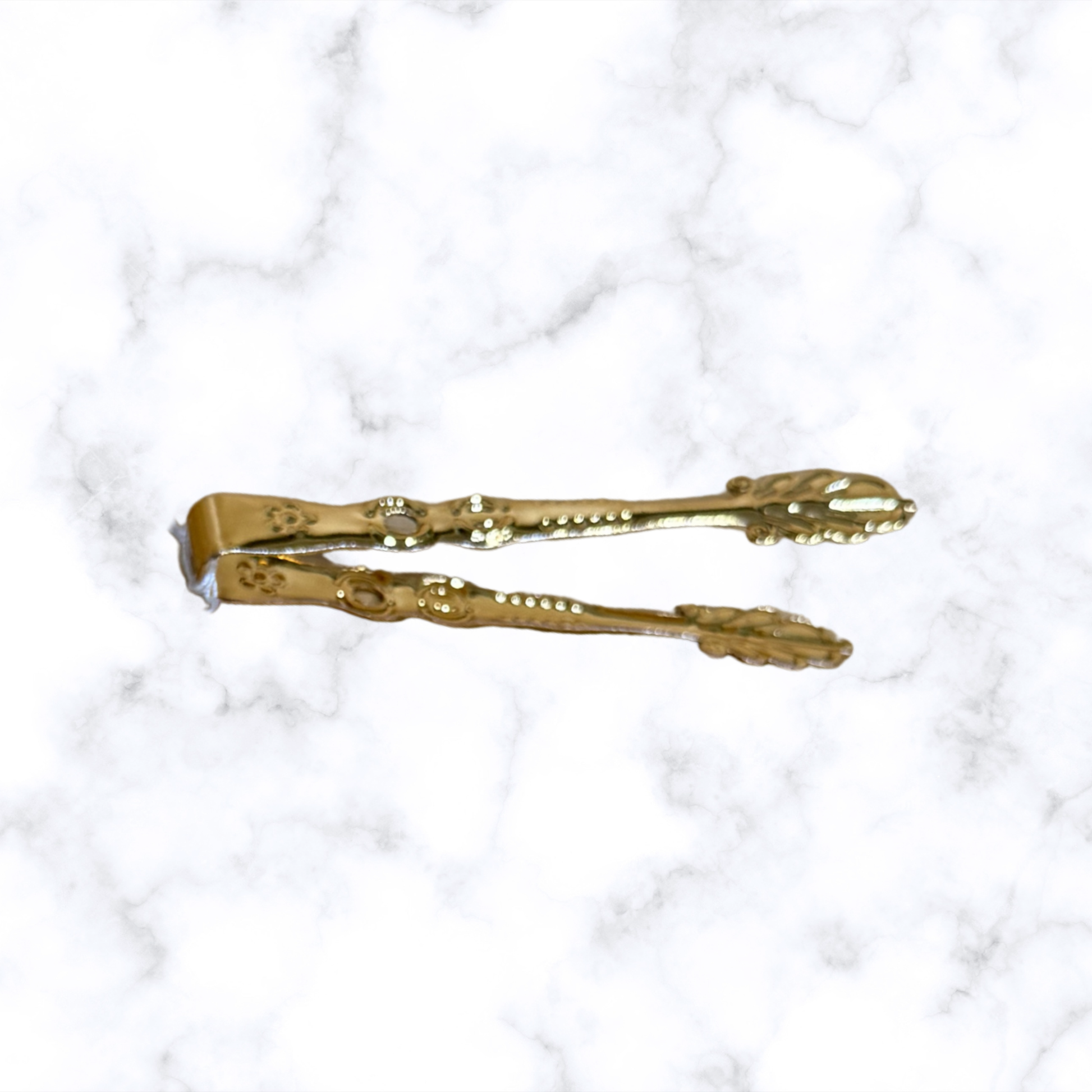 Ornate Orthodox brass charcoal tongs for handling incense charcoal during home prayer and church worship.