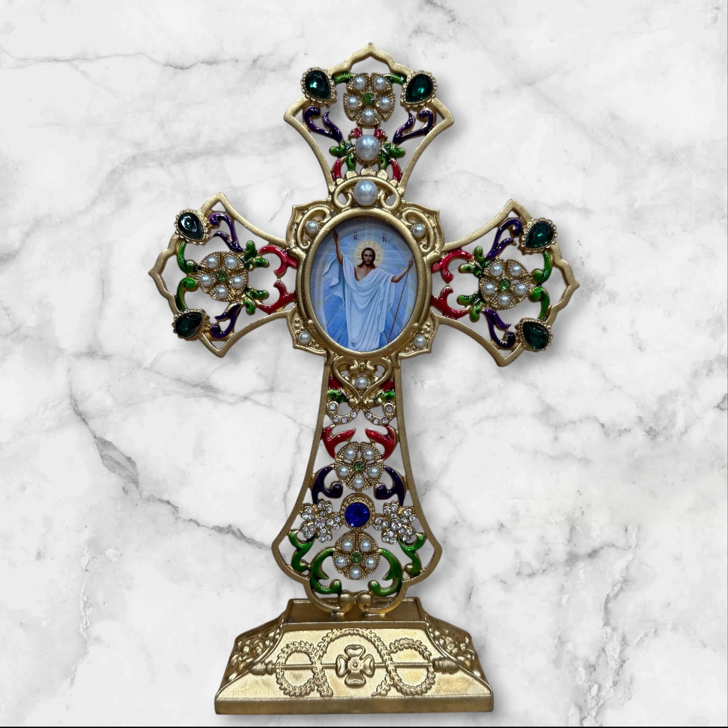 Decorative Orthodox cross-shaped icon stand with colorful enamel accents and a removable oval icon for a home prayer corner