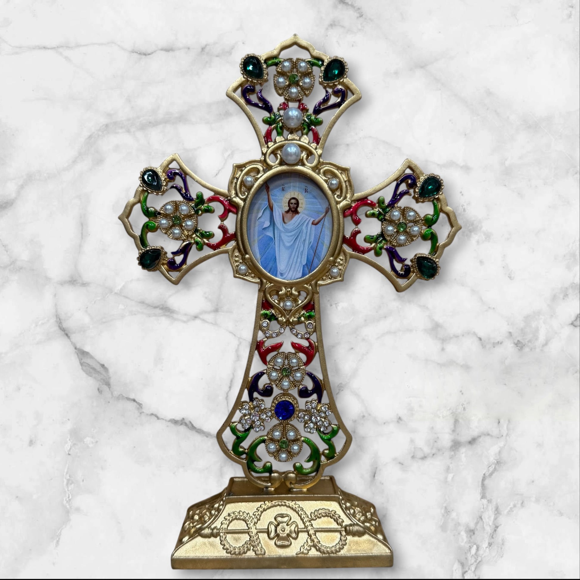 Decorative Orthodox cross-shaped icon stand with colorful enamel accents and a removable oval icon for a home prayer corner