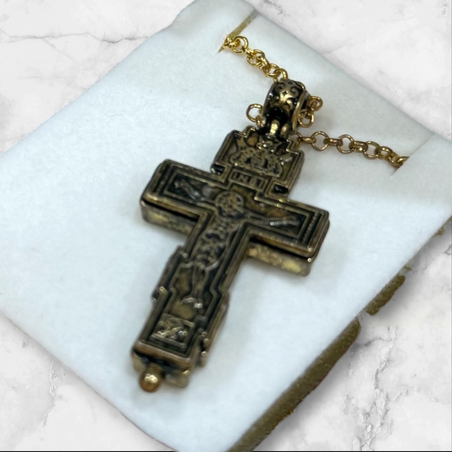 Orthodox two-tone crucifix pendant with double-sided iconography displayed in a velvet gift box back side