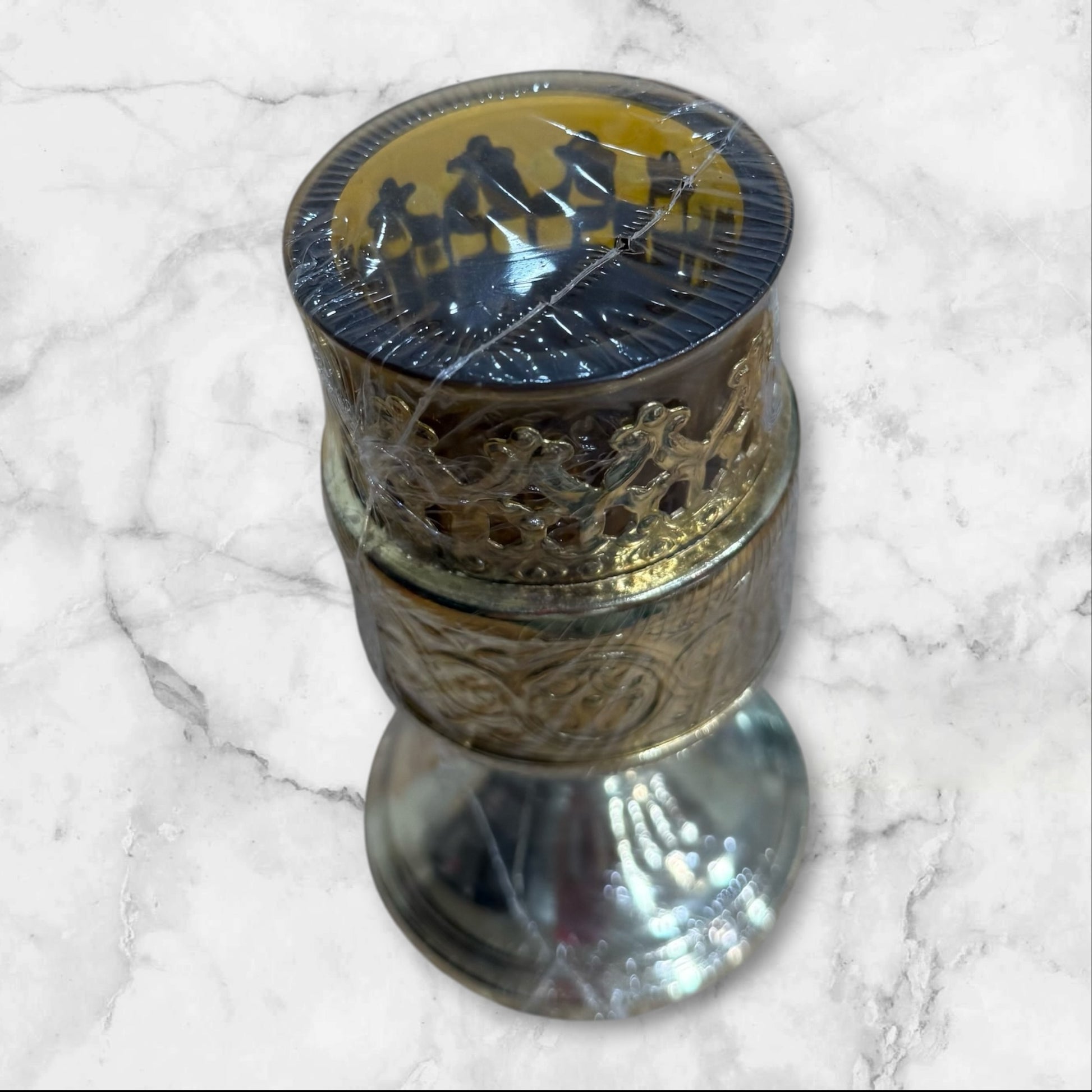 Orthodox silver-tone vigil lamp holder with amber glass cup for a home prayer corner