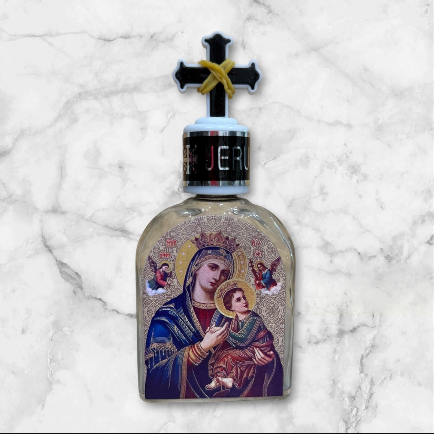 Orthodox holy water bottle featuring the icon of Our Lady of Perpetual Help with decorative cross stopper