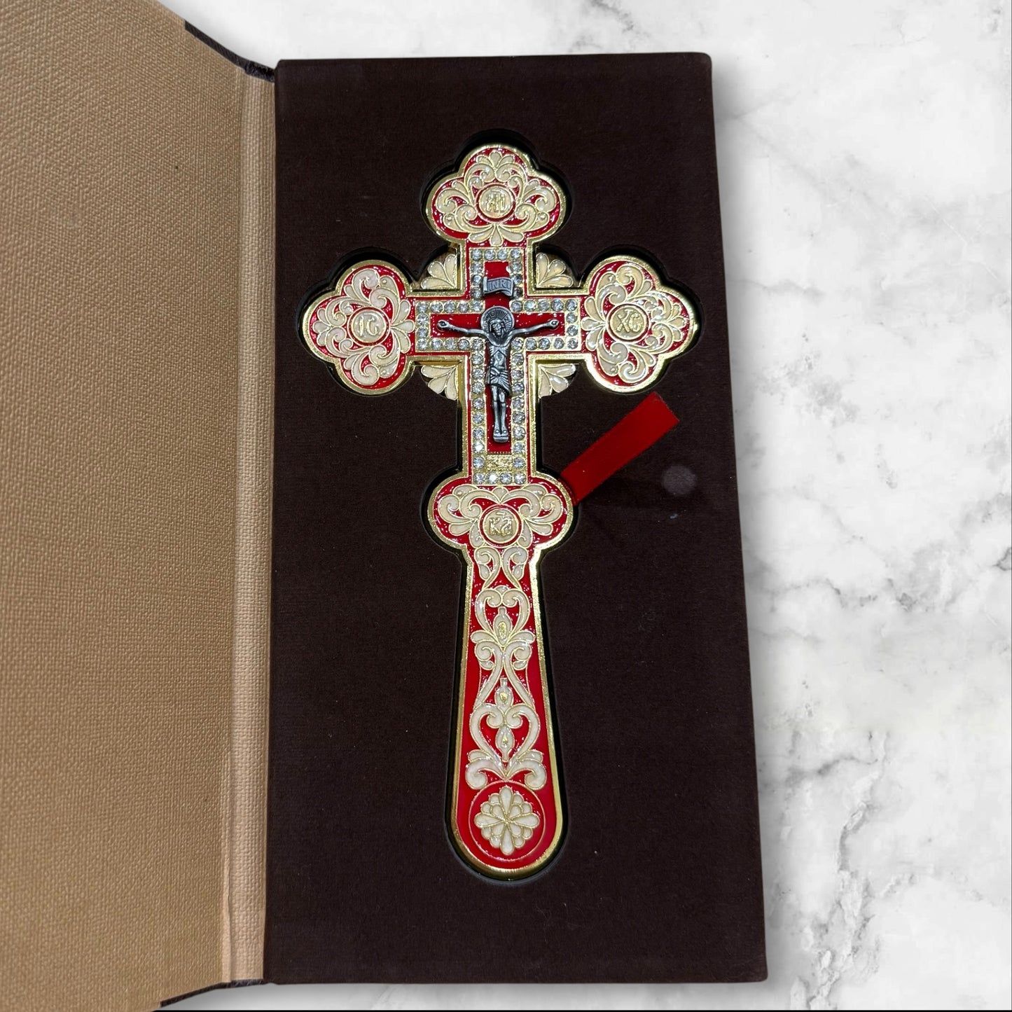 red enamel blessing cross with decorative metal crucifix in a premium gift box, measuring 7.875 inches tall.