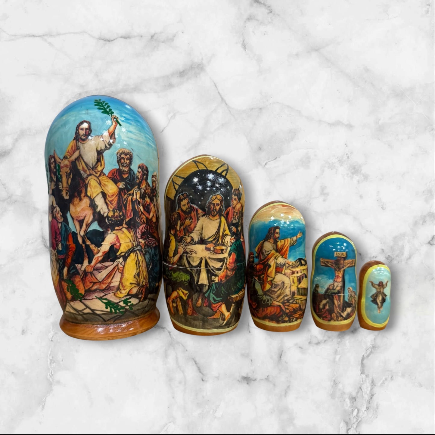 Hand-painted Russian nesting dolls from Sergiev Posad featuring five nesting dolls depicting scenes from the Passion of Christ.