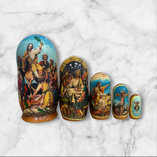 Hand-painted Russian nesting dolls from Sergiev Posad featuring five nesting dolls depicting scenes from the Passion of Christ.