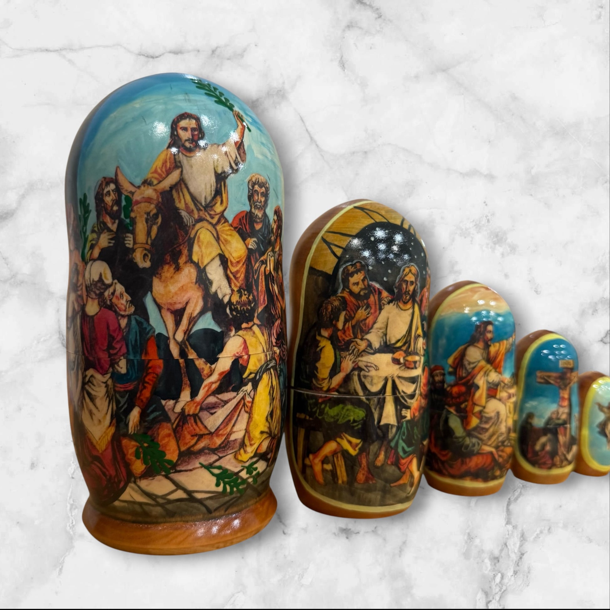 Hand-painted Russian nesting dolls from Sergiev Posad featuring five nesting dolls depicting scenes from the Passion of Christ.