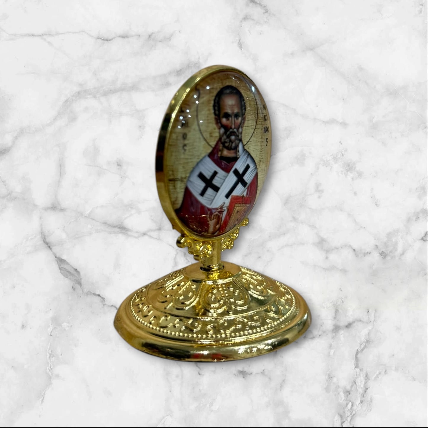Standing Orthodox icon of Saint Nicholas the Wonderworker with decorative gold base and self-adhesive mounting side view