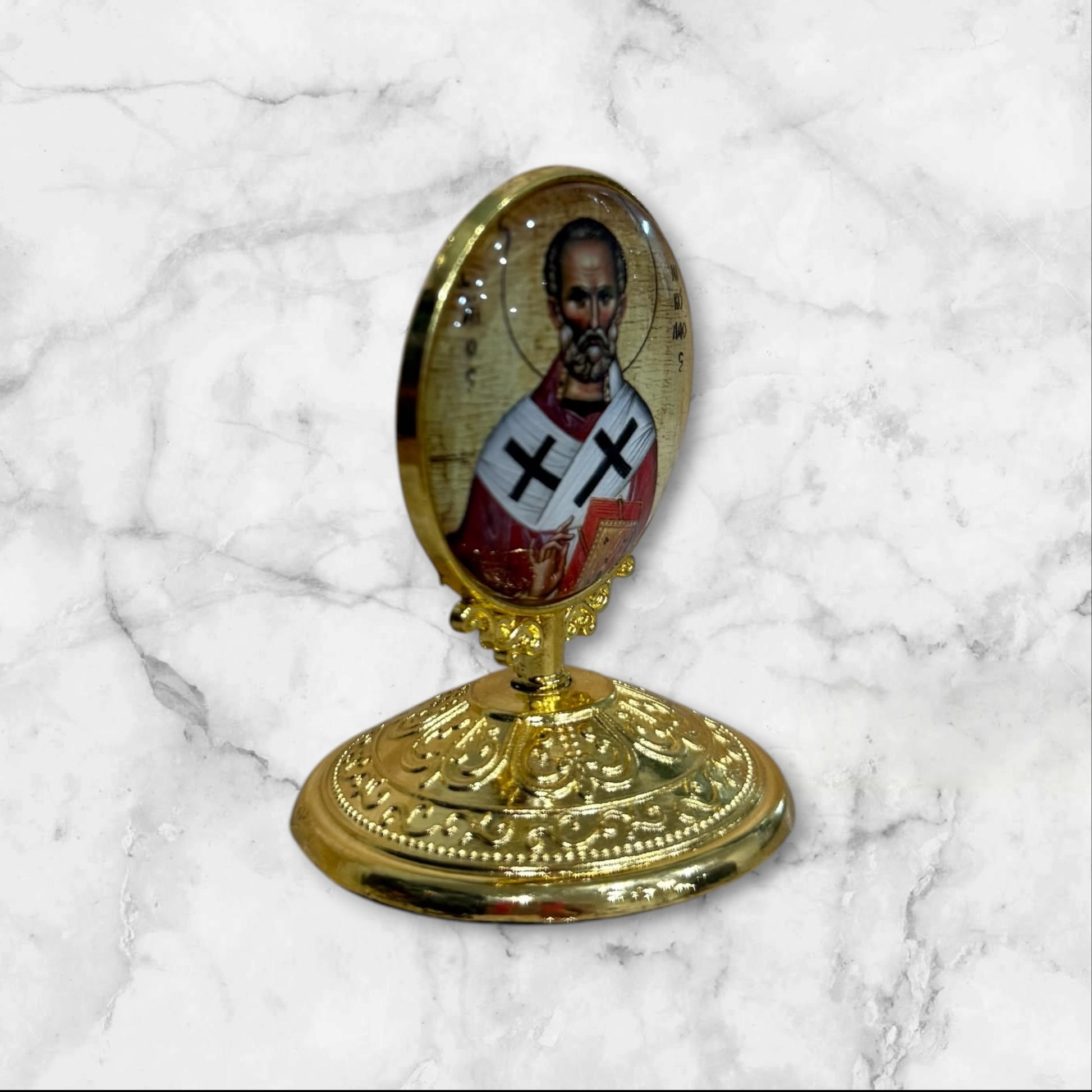 Standing Orthodox icon of Saint Nicholas the Wonderworker with decorative gold base and self-adhesive mounting side view
