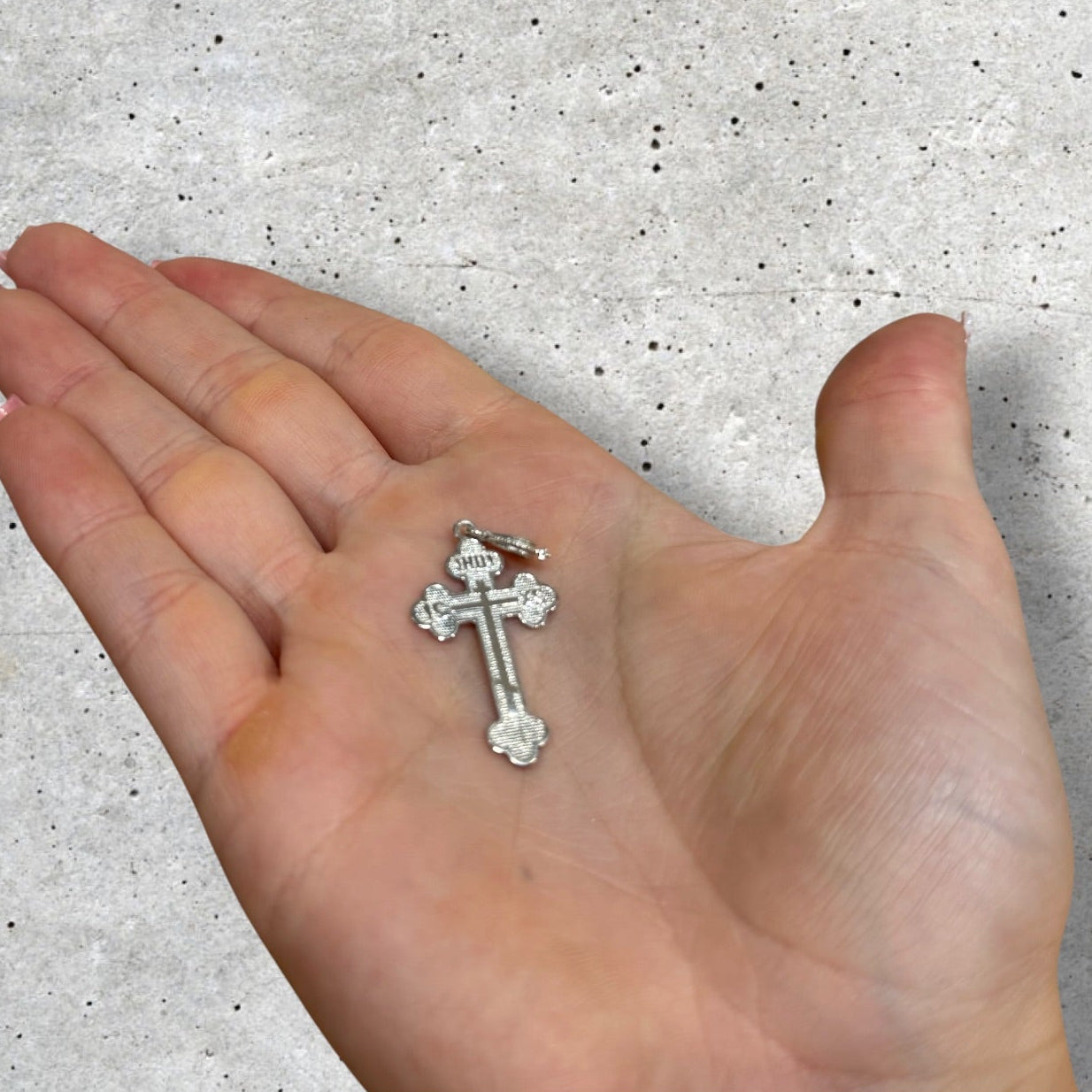 scale of sterling silver Orthodox cross pendant