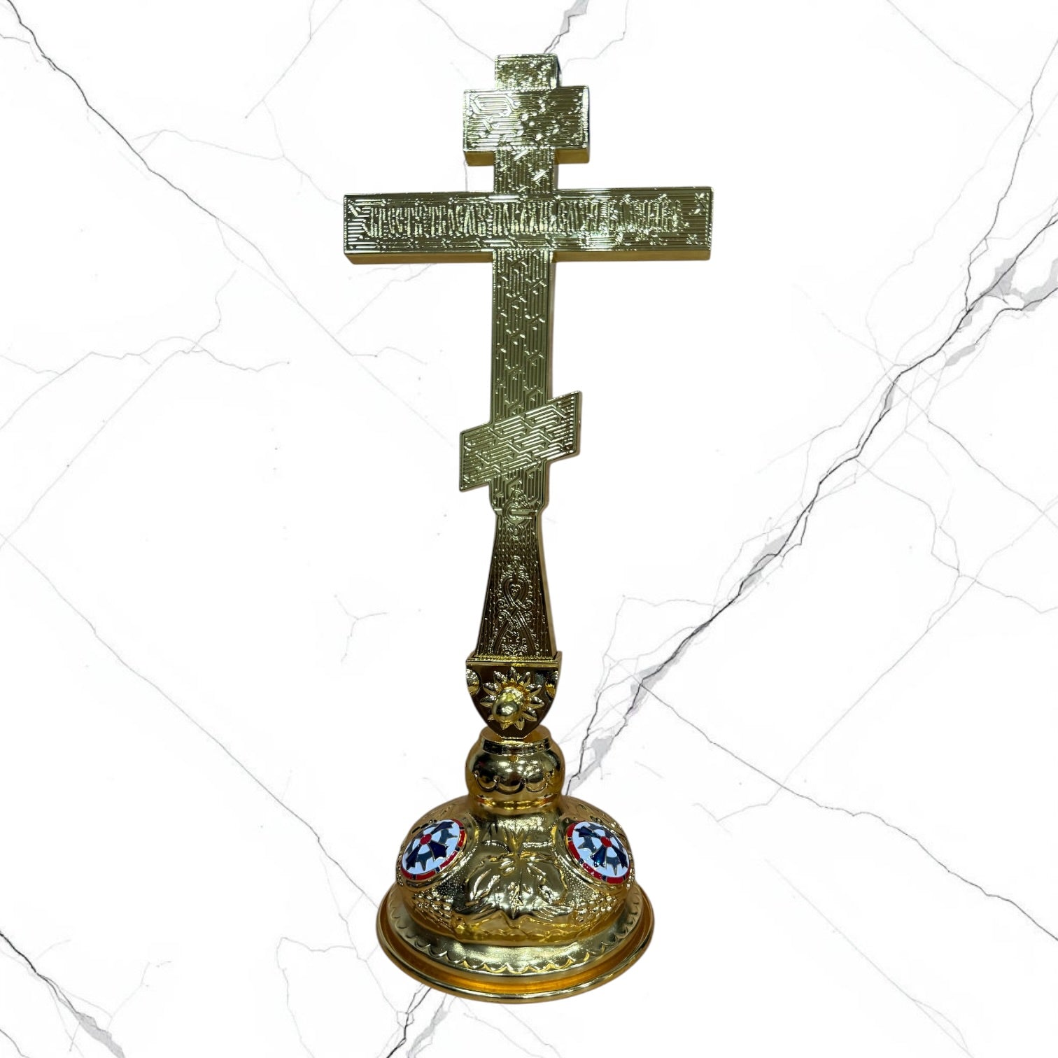 Gold-tone Orthodox standing blessing cross with red lettering, Crucifixion, ornamental handle, and decorative base.