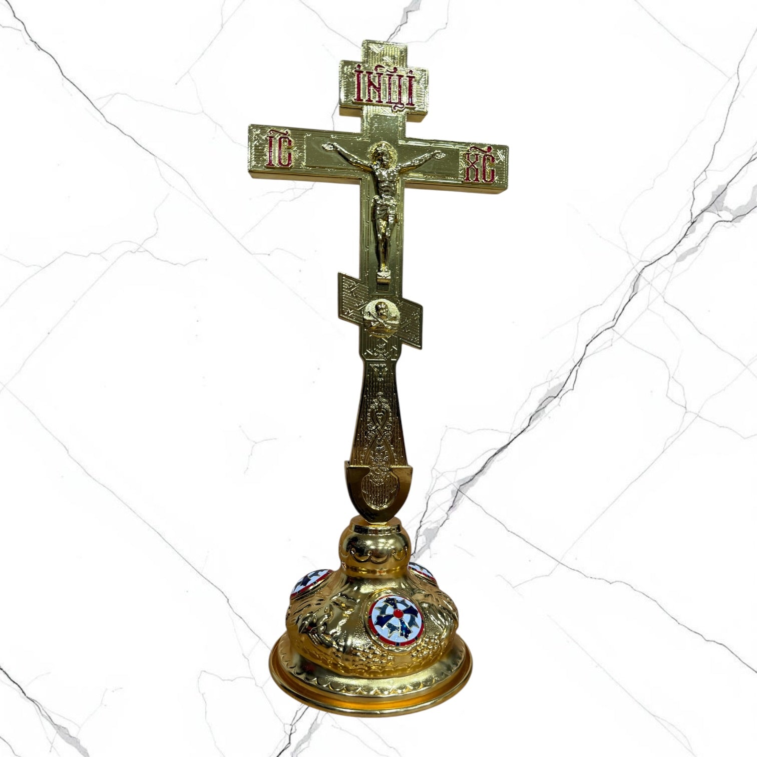 Gold-tone Orthodox standing blessing cross with red lettering, Crucifixion, ornamental handle, and decorative base.