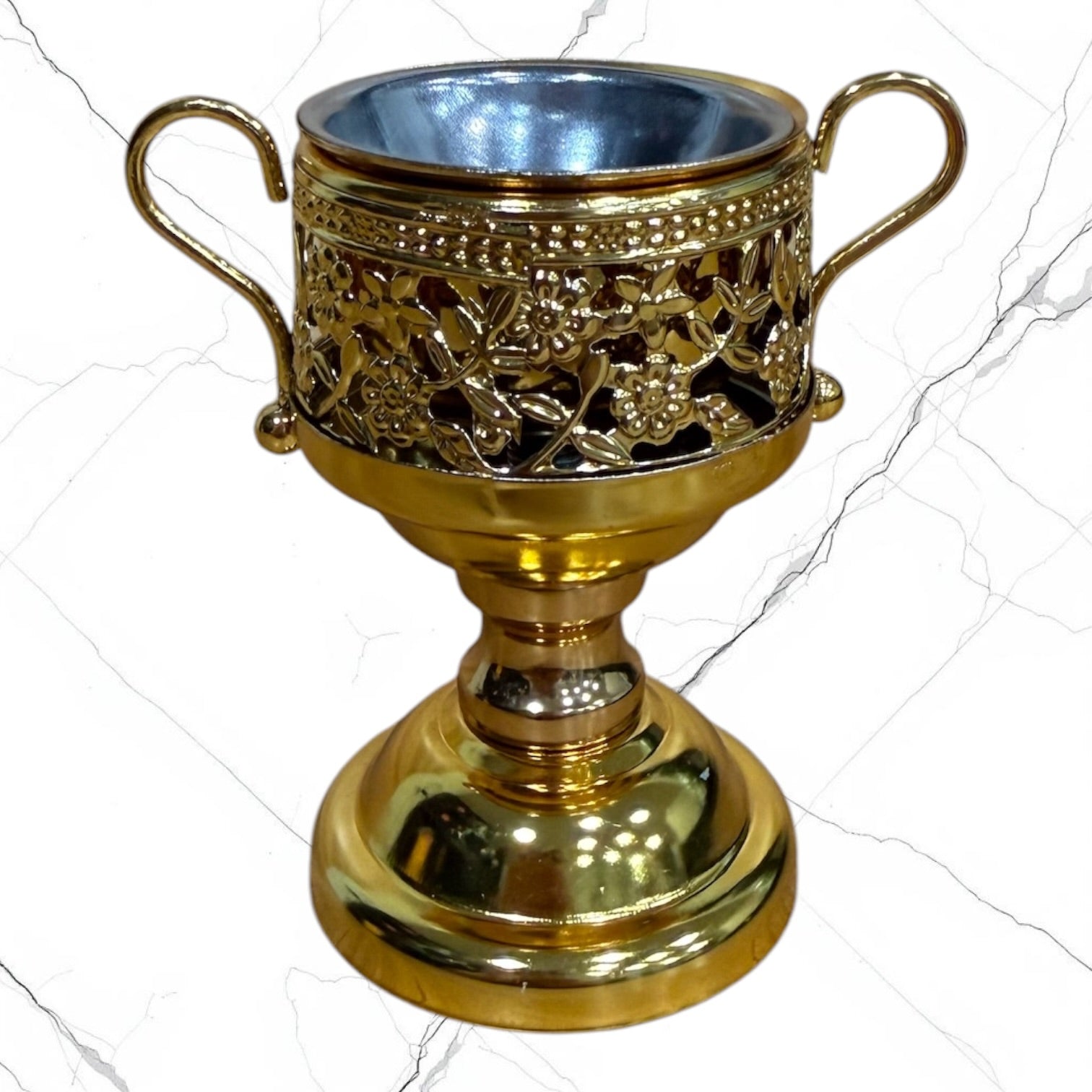 Gold-tone standing incense burner with decorative scroll handles, removable cross lid, charcoal cup, and pedestal base for burning incense during prayer.