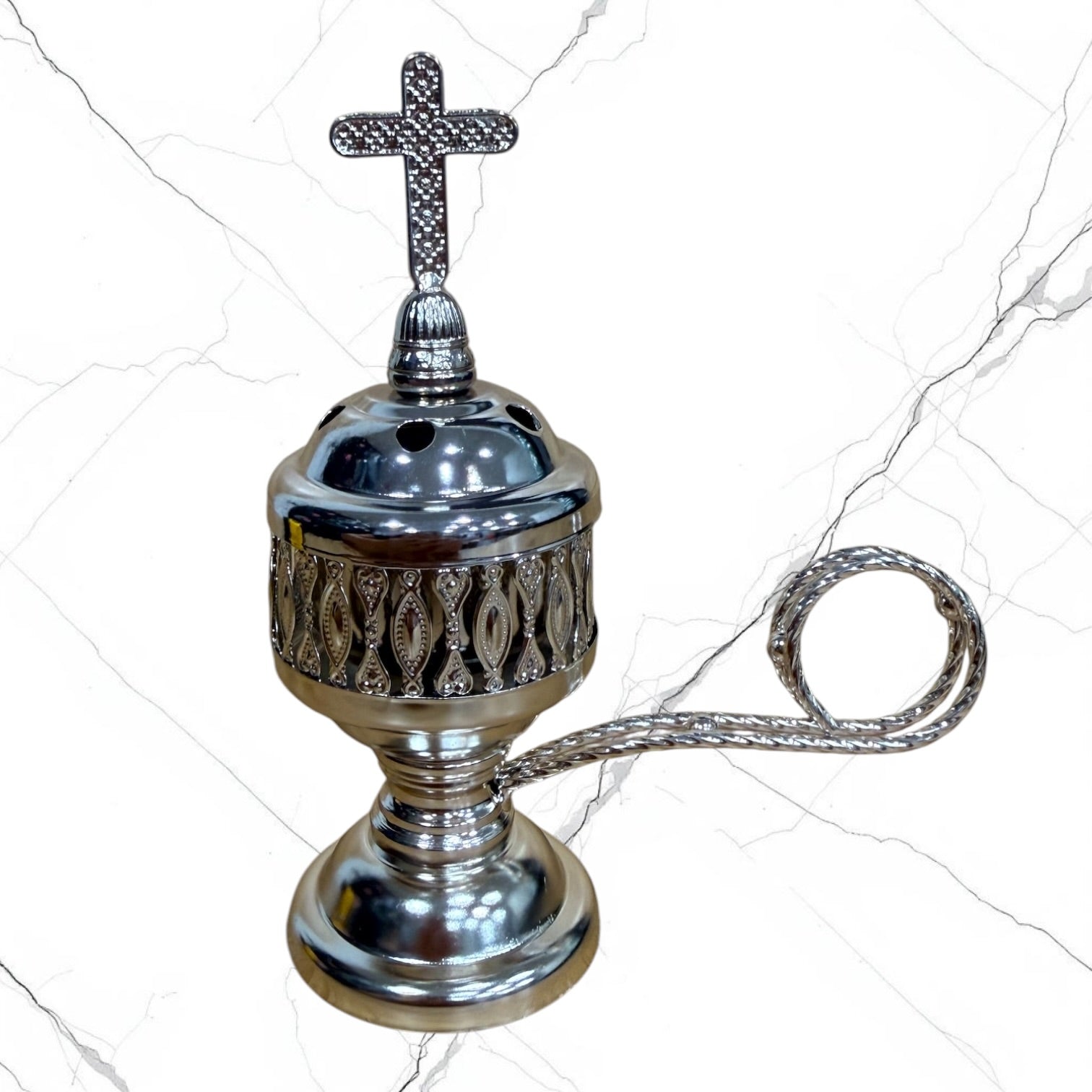 Silver-tone standing incense burner with carrying handle, removable cross lid, charcoal cup, and pedestal base for burning incense during prayer.