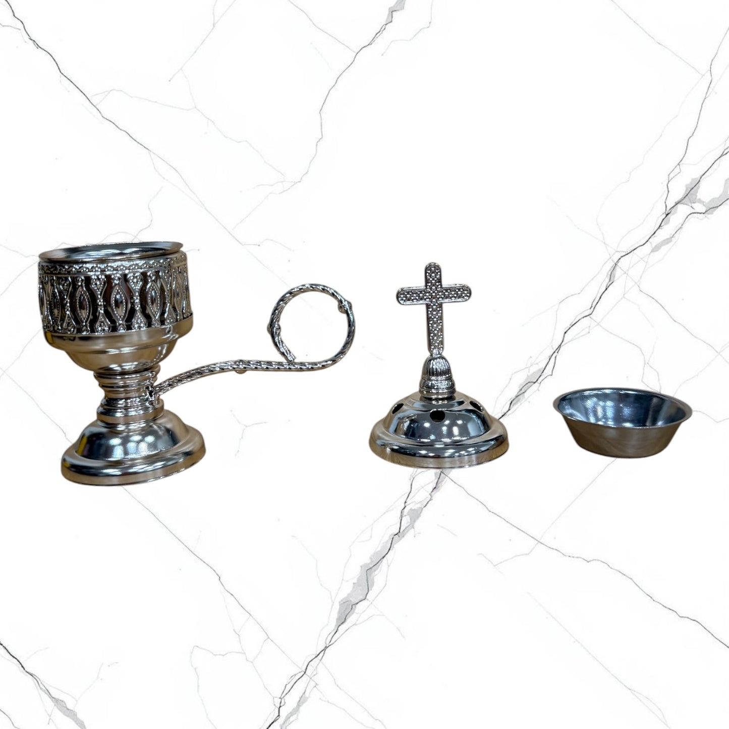 Silver-tone standing incense burner with carrying handle, removable cross lid, charcoal cup, and pedestal base for burning incense during prayer.