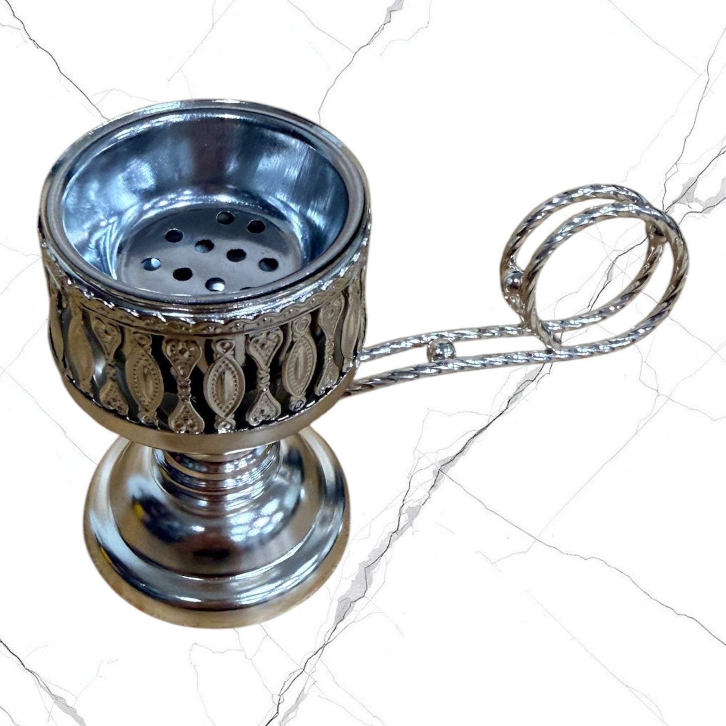 Silver-tone standing incense burner with carrying handle, removable cross lid, charcoal cup, and pedestal base for burning incense during prayer.