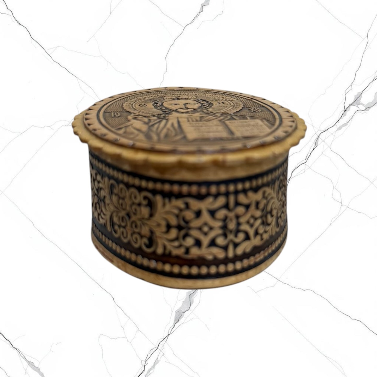Side view of the wooden Christ the Teacher keepsake box showing carved decorative details.